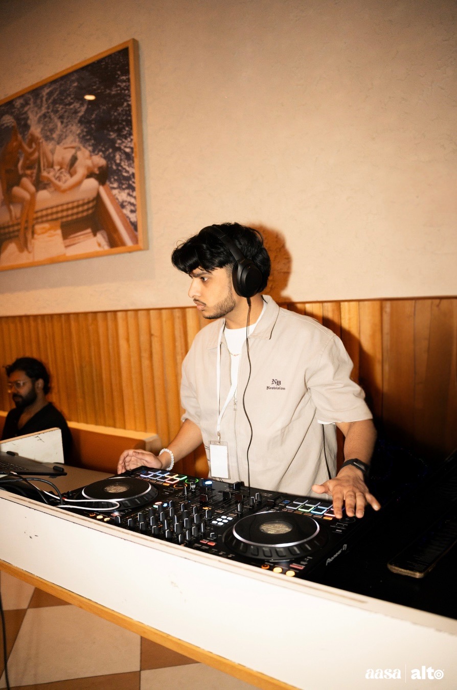 YUVI performing at an indoor set